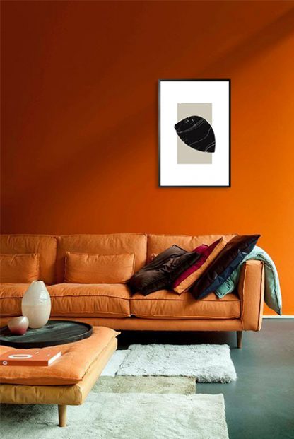 Black object on neutral color rectangle poster in interior