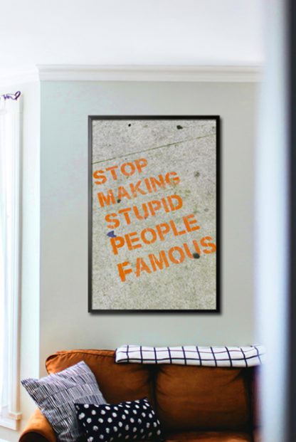 Stop making stupid people famous poster in interior