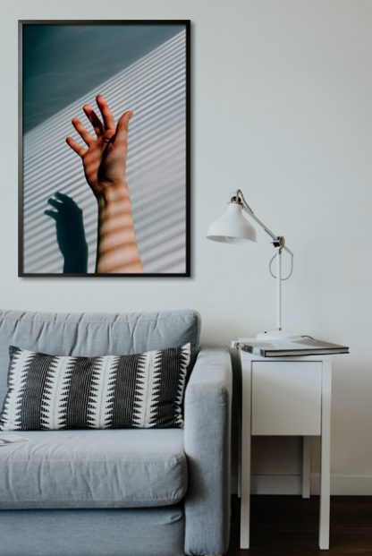 Hand photo with horizontal shadow effect poster in interior