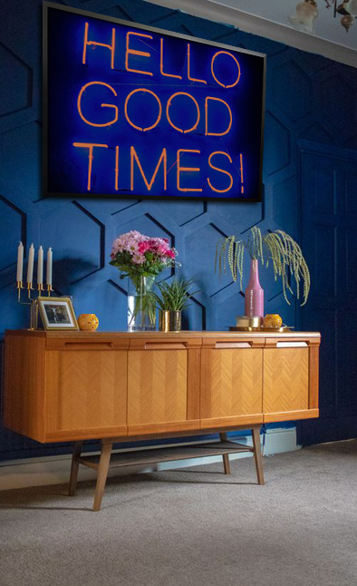 Neon hello good times poster in interior