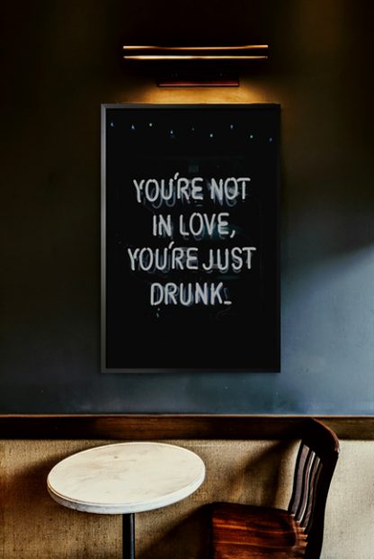 Neon you're not in love you're just drunk poster in interior