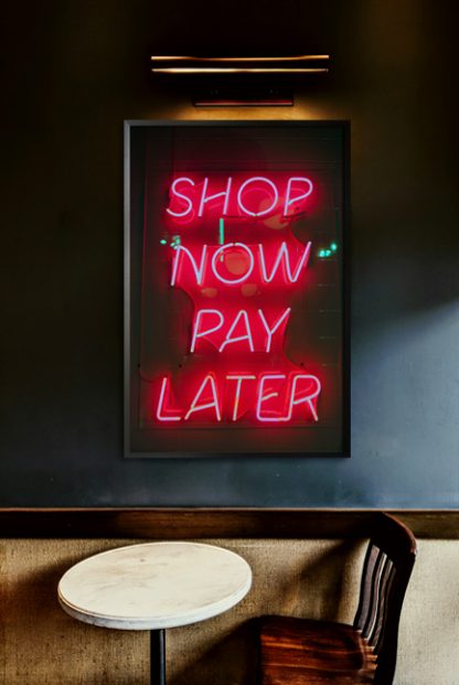 Neon shop now pay later poster in interior