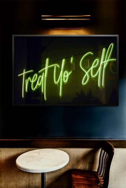 Neon treat yo self poster in interior