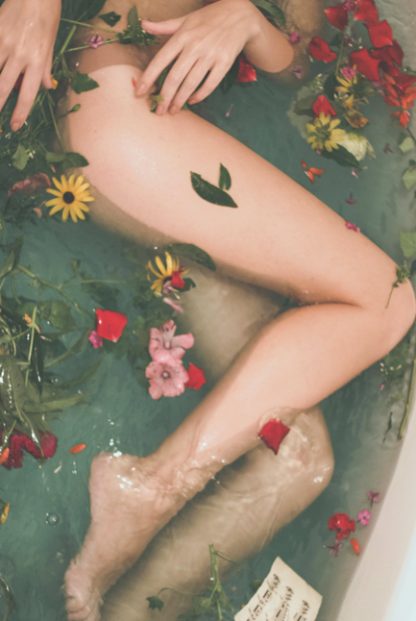 Bathtub filled with flowers poster