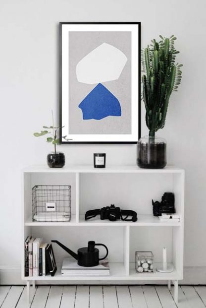 Blue and white rock balance poster in interior