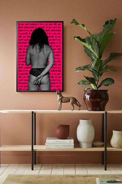Women facing pink wall poster in interior