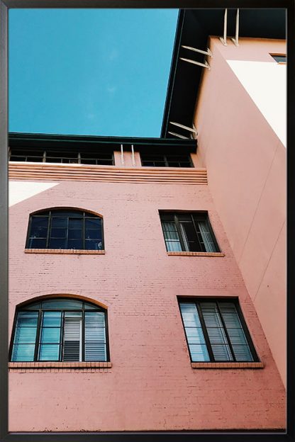 Worms eye view of house poster in a black frame