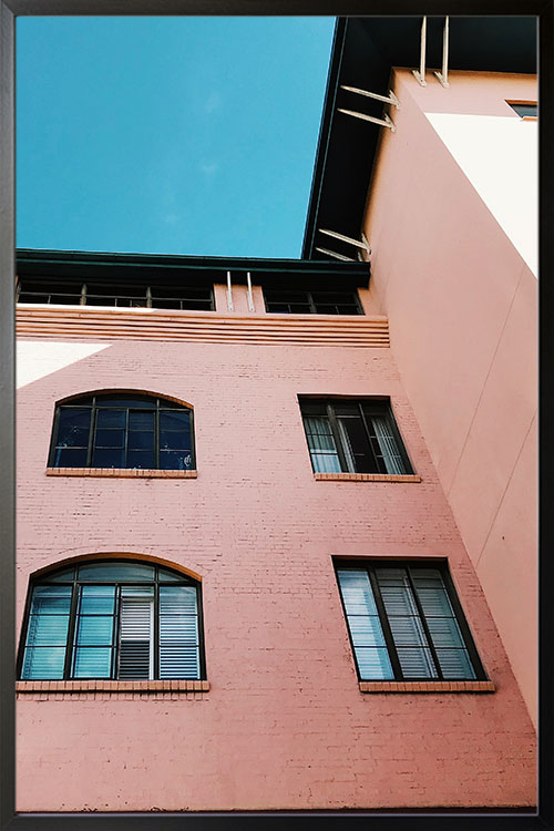 Worms eye view of house poster in a black frame