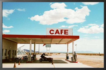 Cafe on the road poster in a black frame