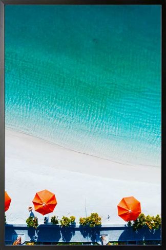 Orange umbrella on the beach poster in a black frame