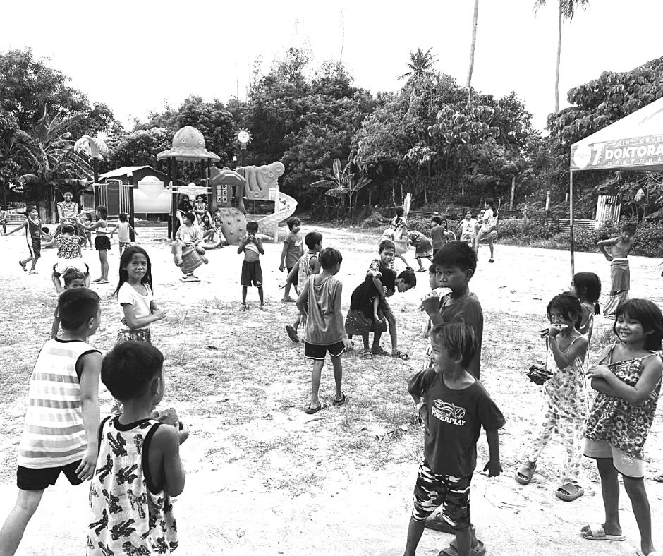 The Balesin community with children in the playground