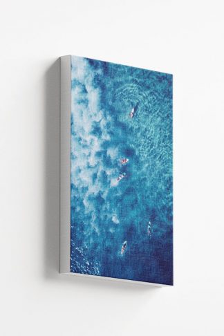 Surfing on a blue water canvas