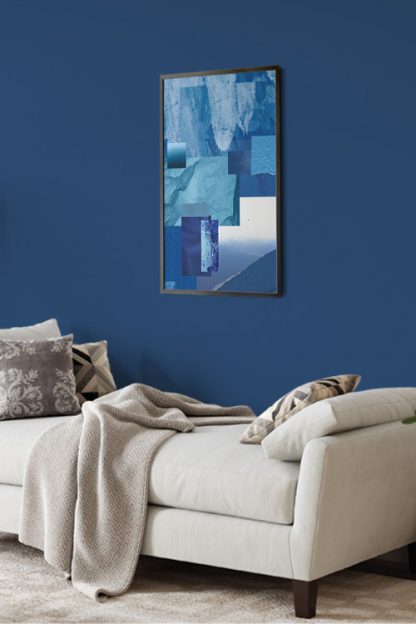 Fragment of Blue 1 Poster in a black frame on a blue wall with gray sofa