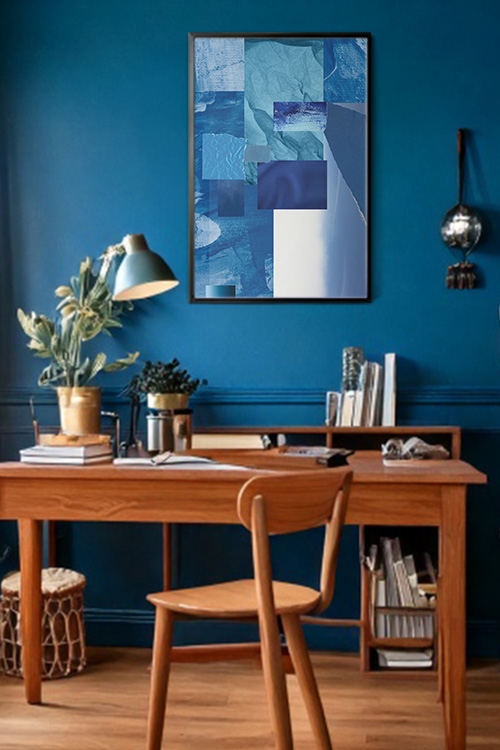 Fragment of Blue 2 Poster in a black frame on a blue wall on top wooden study table with books and lamps