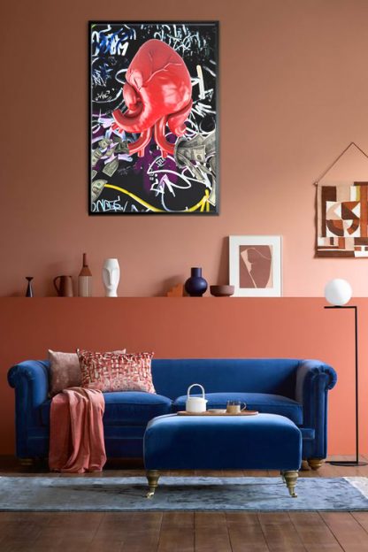 My Heart Speaks Poster in a black frame inside the living room with blue big sofa