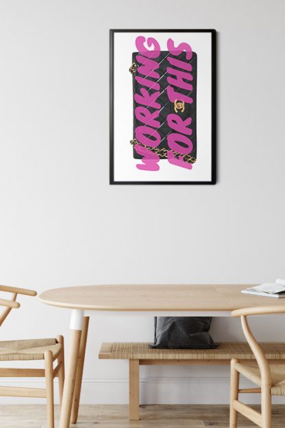 Work For This Typography Poster in a black frame with wood table and chairs