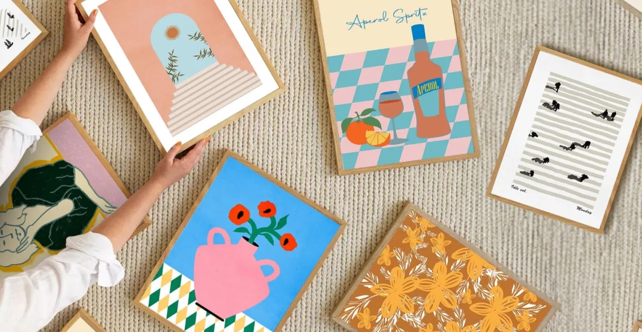 Playful framed poster art prints scattered on a floor
